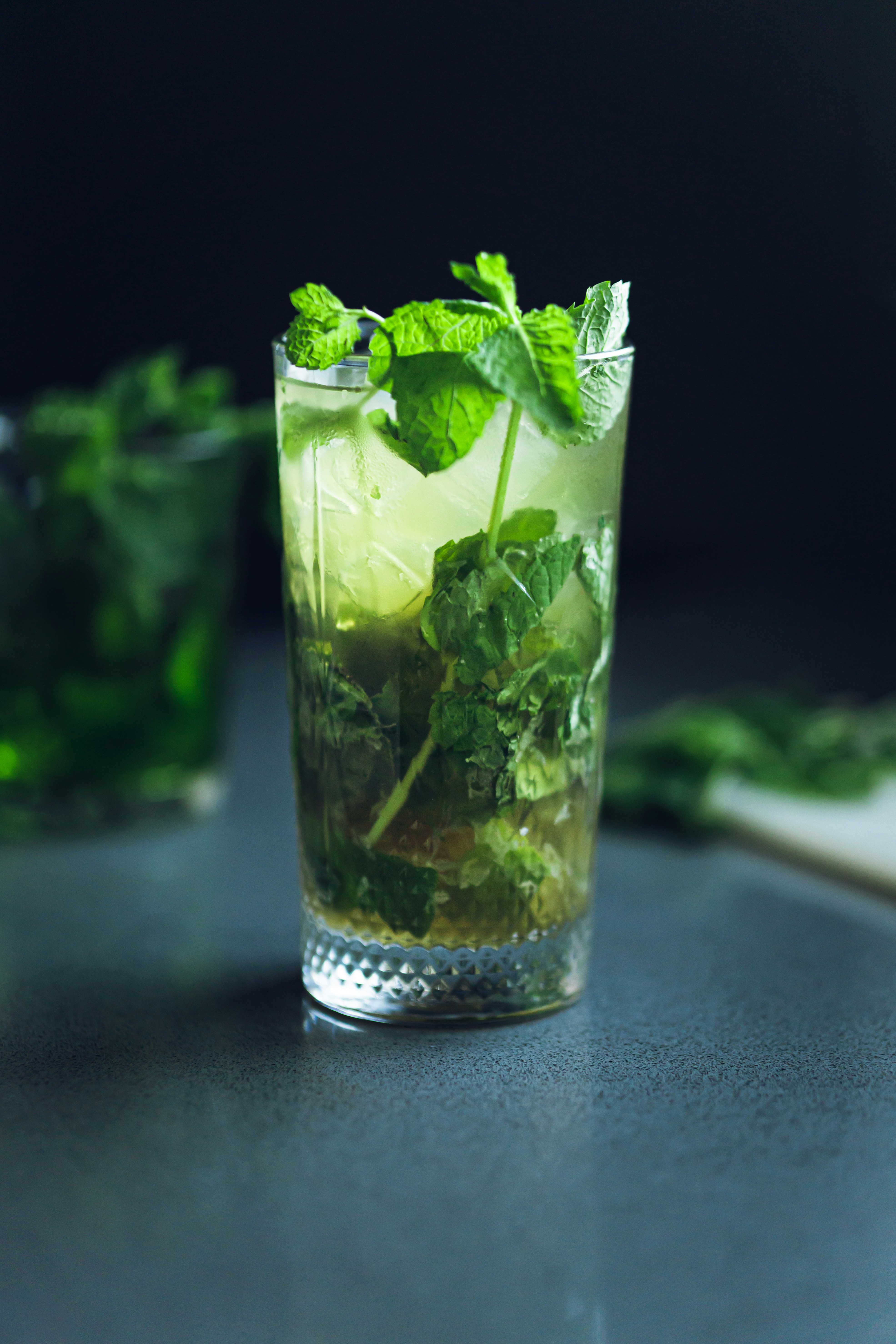 Tall highball crowned with fresh mint leaves.